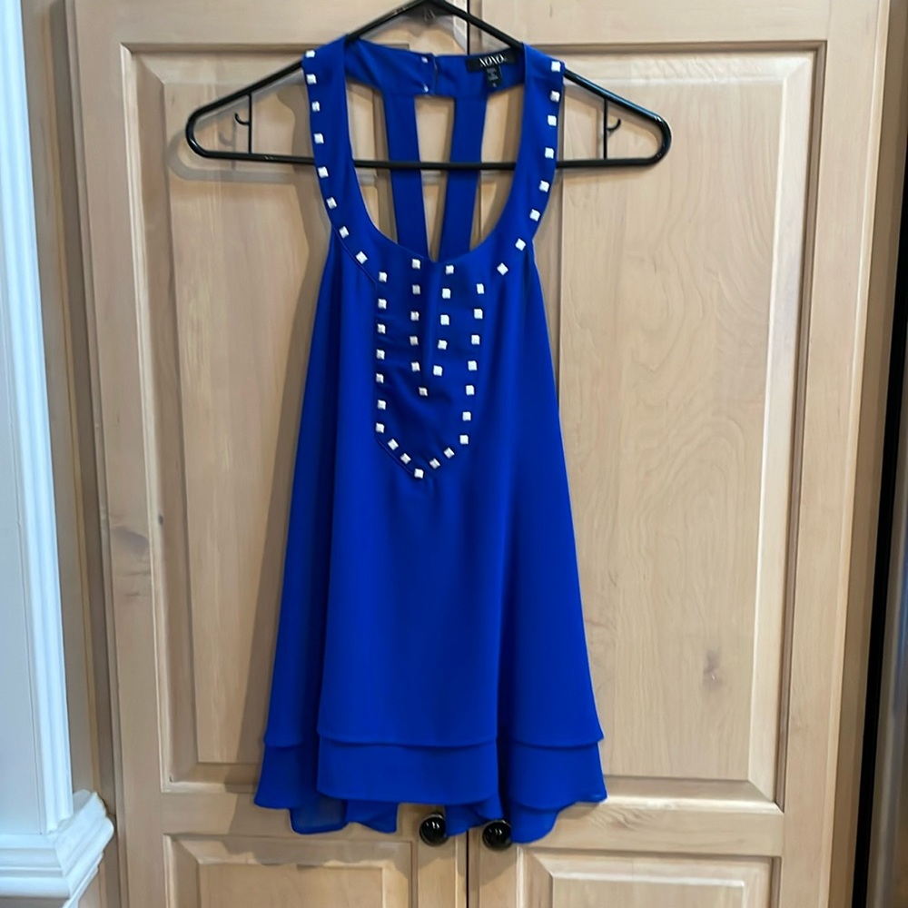 XOXO Blue top with square emblems.